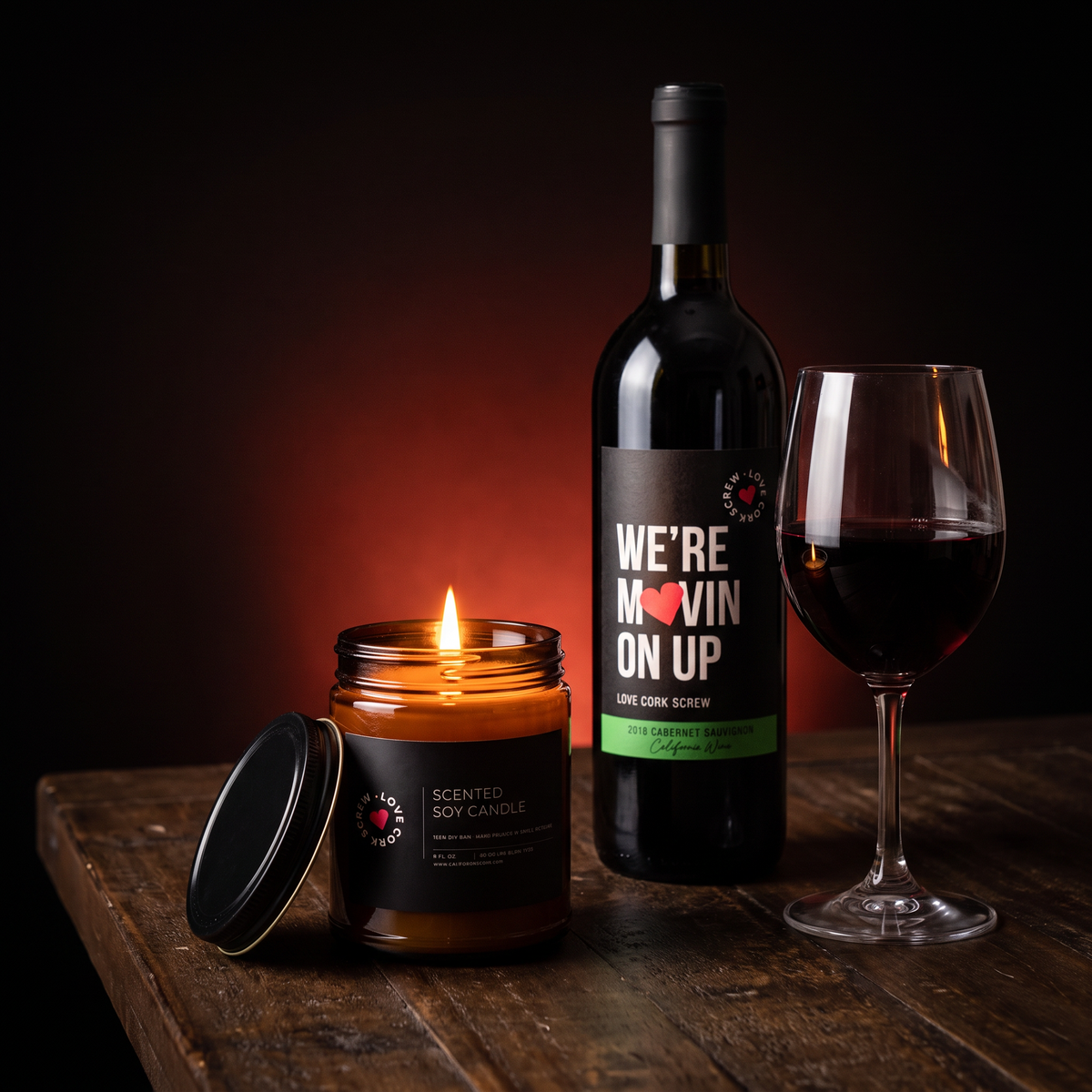 Love Cork Screw 9oz soy candle glowing on a dark table with red wine