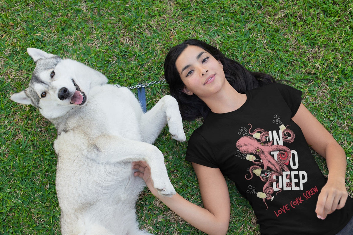 Woman lying in the grass with her husky, wearing the black In Too Deep tee by Love Cork Screw