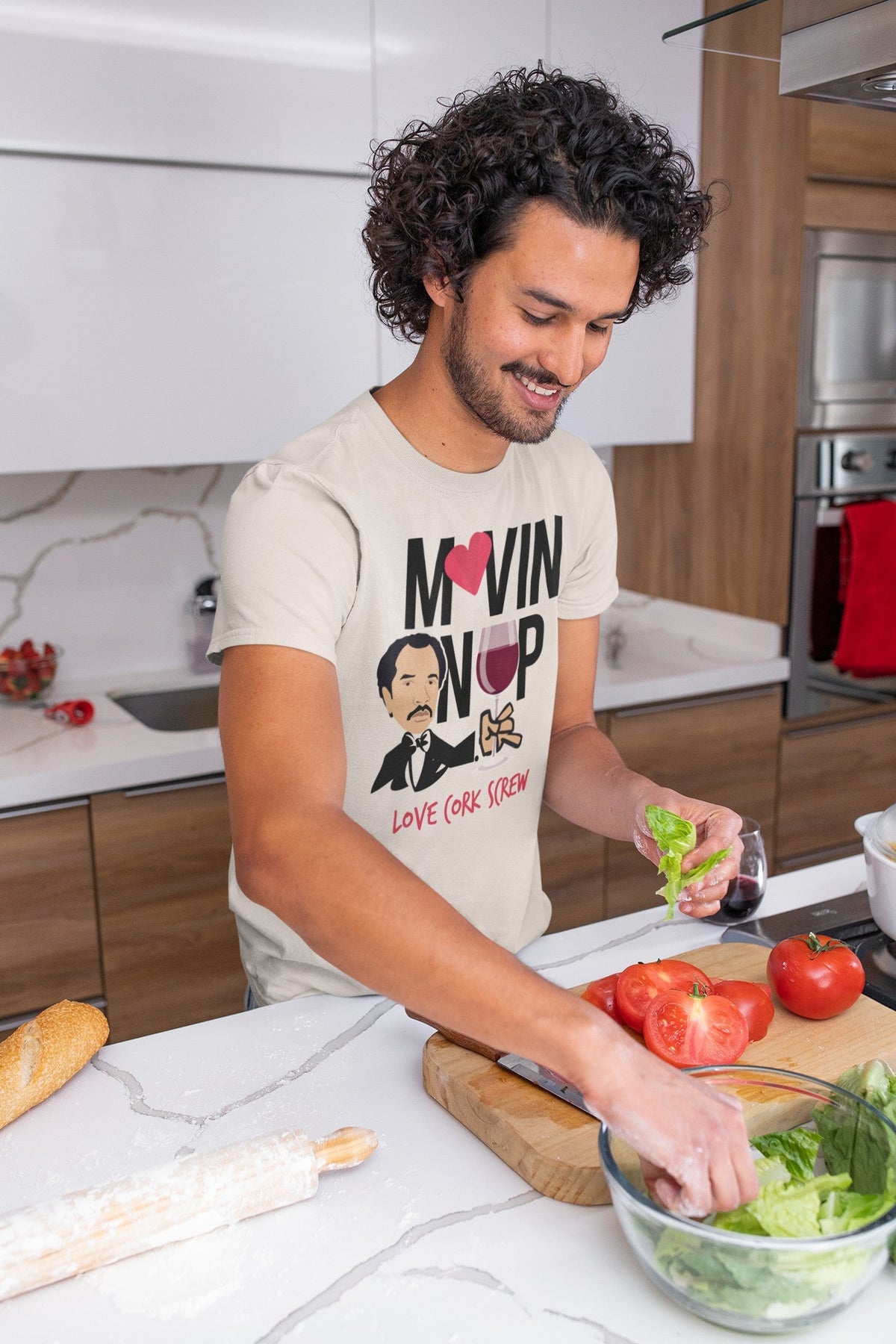 Man cooking in the Movin' On Up tee by Love Cork Screw